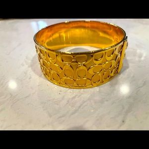 Coach signature gold tone bracelet